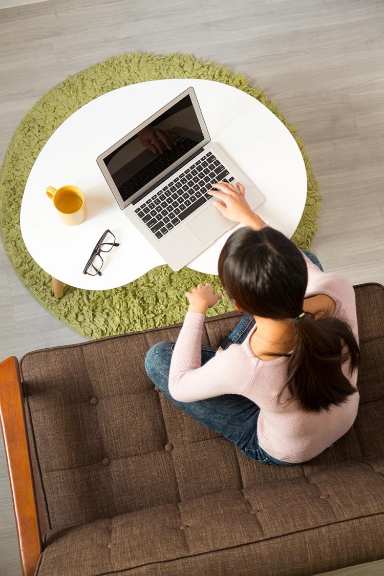 women using laptop at table