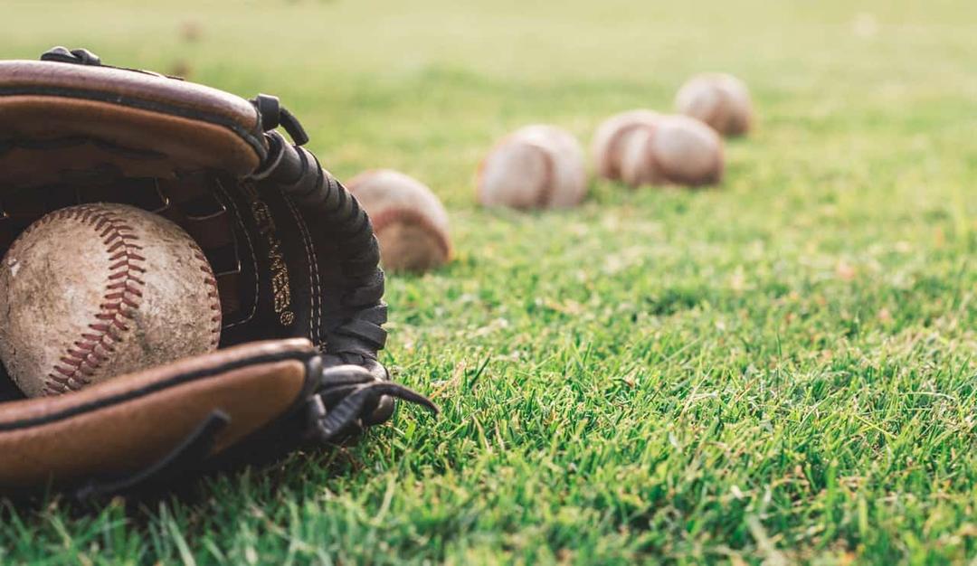 Springfield CArdinals baseballs on grass with mitt