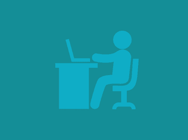 Outline of a person sitting at a desk with a laptop